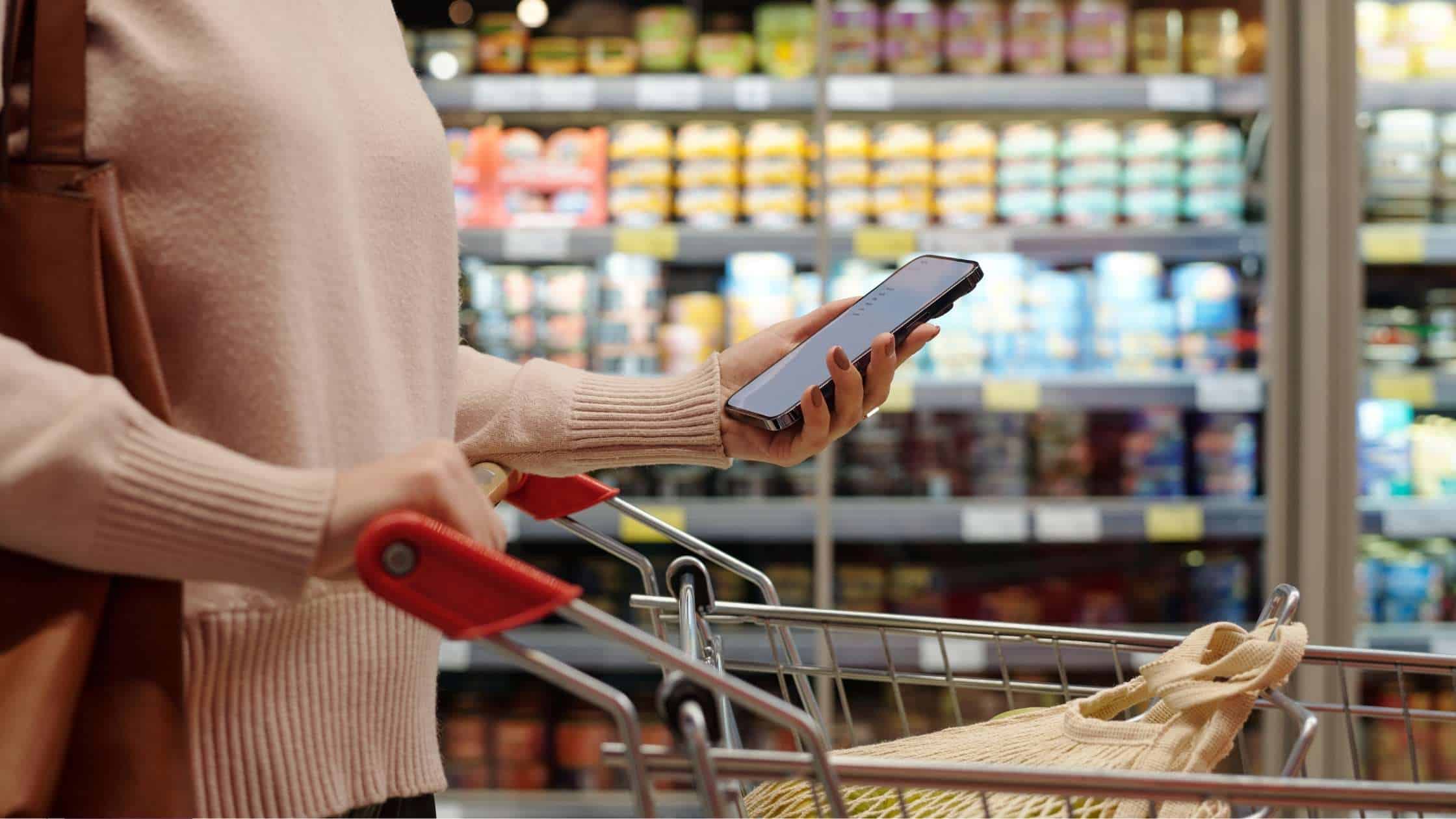 Image of a personal grocery shopper shopping from a mobile shopping list.